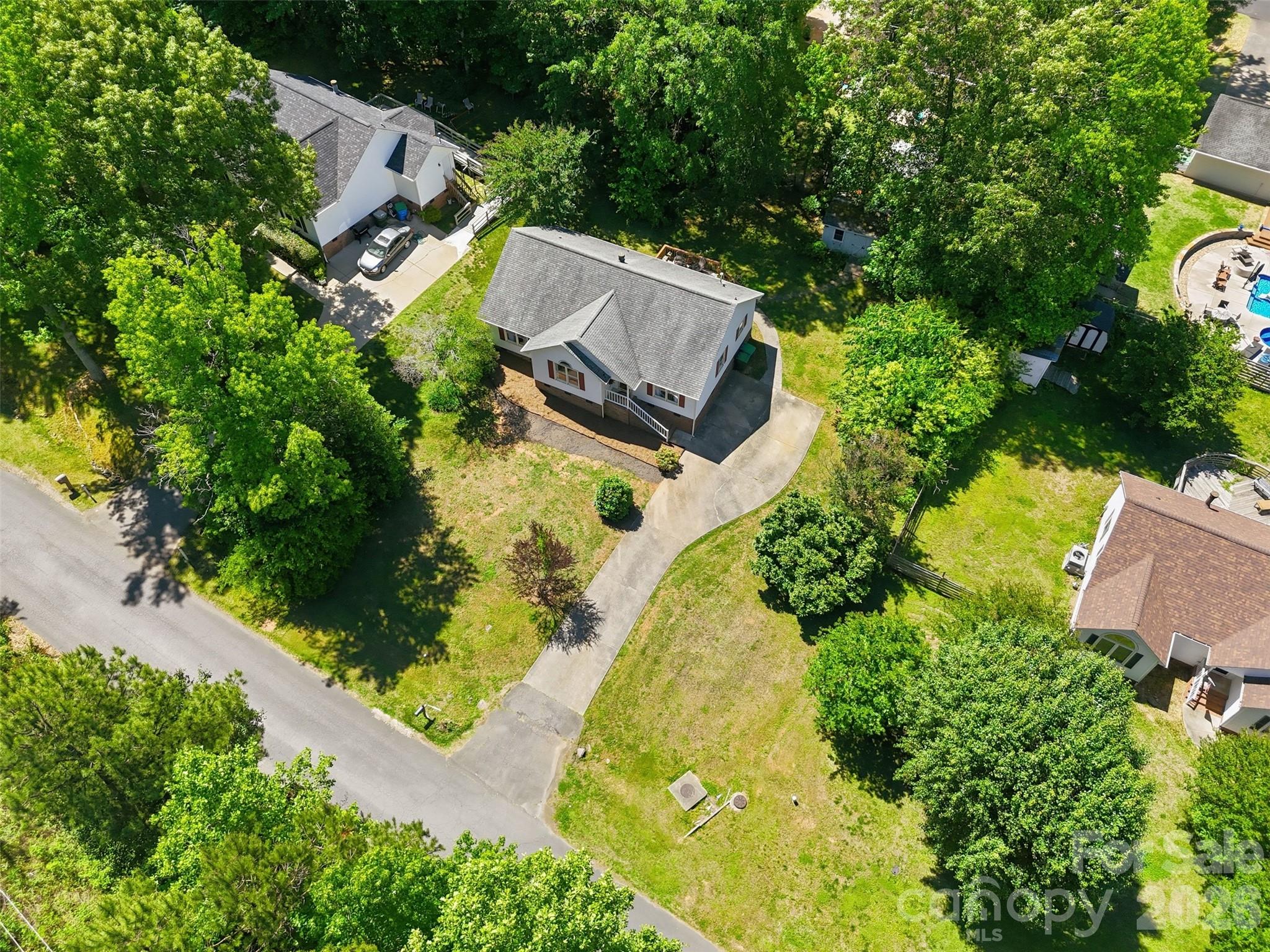 913 Pleasant Ridge Road Fort Mill, SC 29715 - Photo 30 of 40 an aerial view of a house with swimming pool and garden