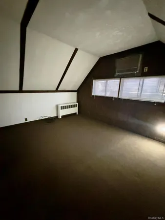 a view of an empty room with windows