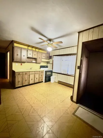 a large white tub sitting in a kitchen
