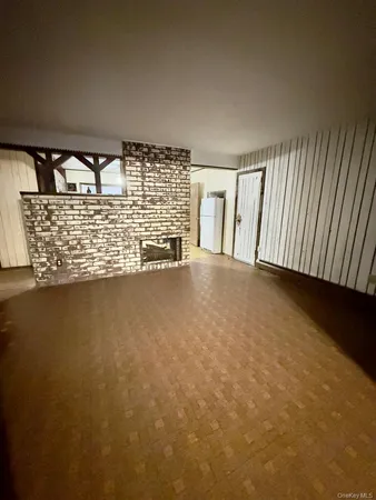 a view of water heater room with windows
