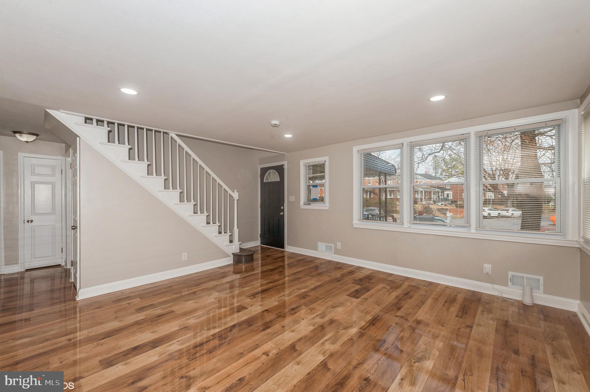 6236 The Alameda Baltimore, MD 21239 - Photo 3 of 15 a view of an empty room with wooden floor and a window