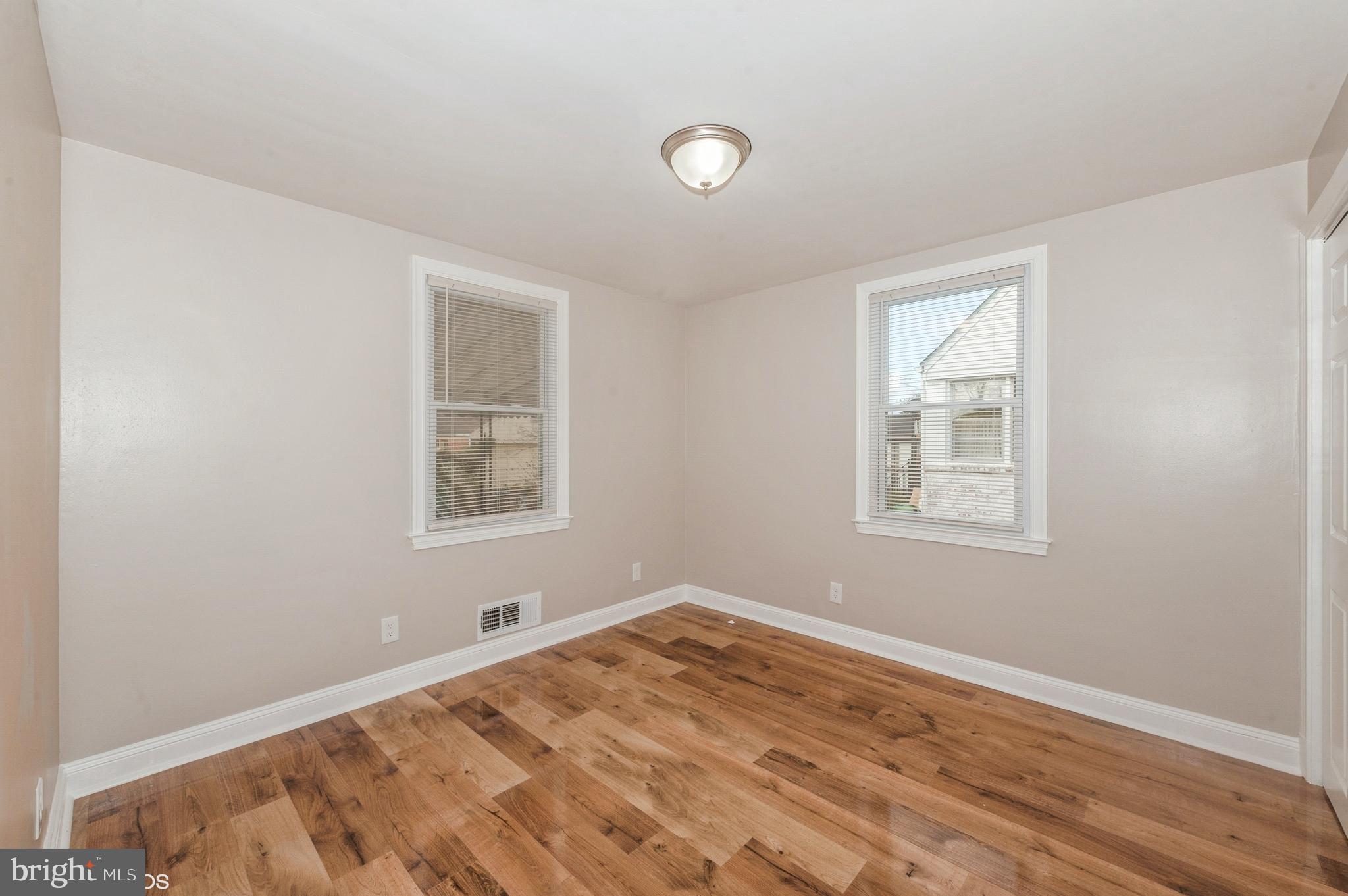 6236 The Alameda Baltimore, MD 21239 - Photo 8 of 15 a view of a room with wooden floor and windows