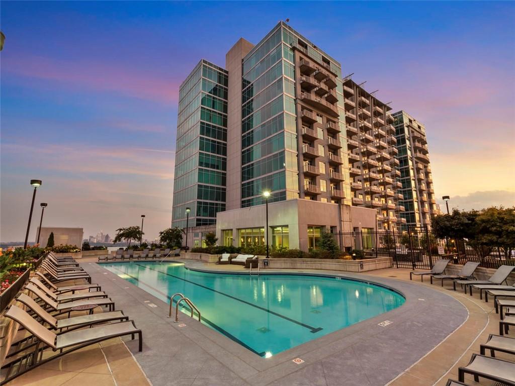250 Pharr Road Northeast, Unit 1109 Atlanta, GA 30305 - Photo 1 of 1 a view of a tall building next to a road