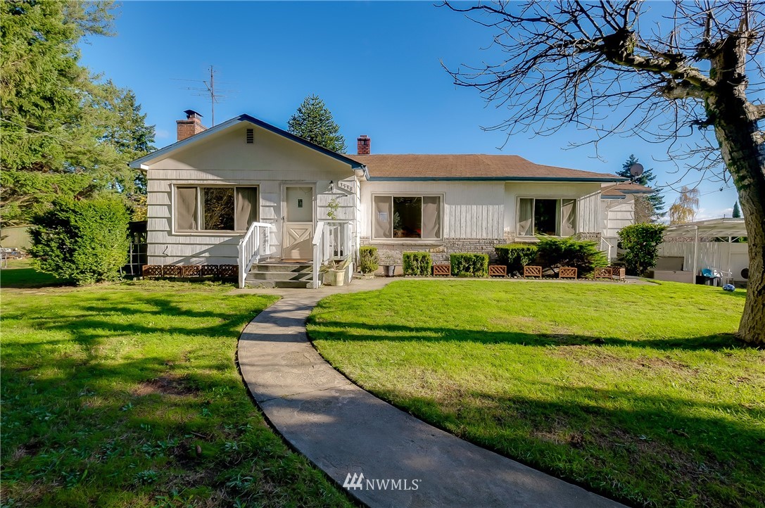 3530 Pine Road Bremerton, WA 98310 - Photo 1 of 34 a front view of a house with a garden