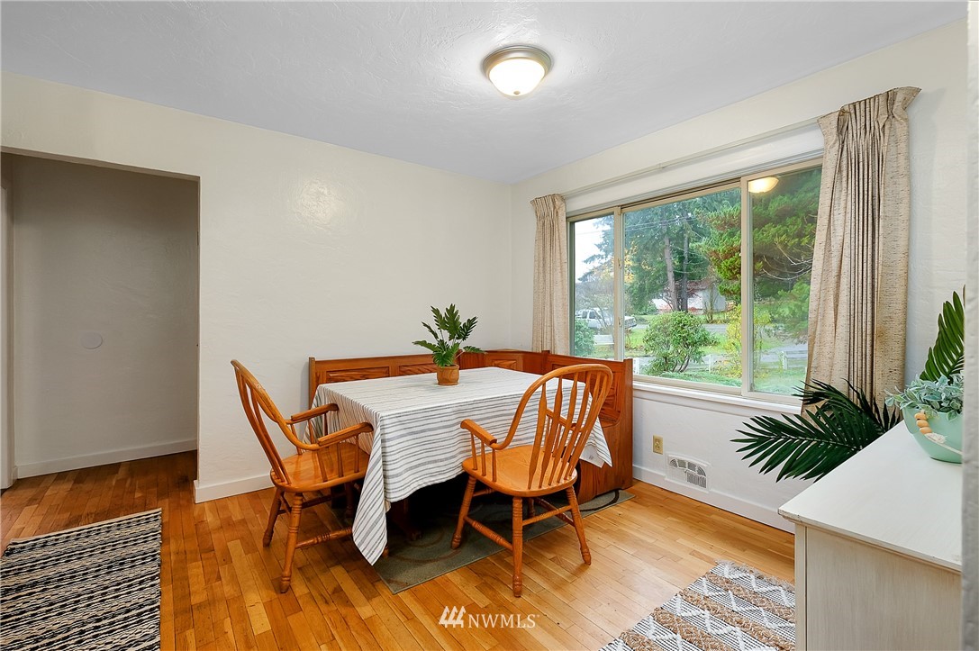 3530 Pine Road Bremerton, WA 98310 - Photo 13 of 34 a dining room with furniture and wooden floor