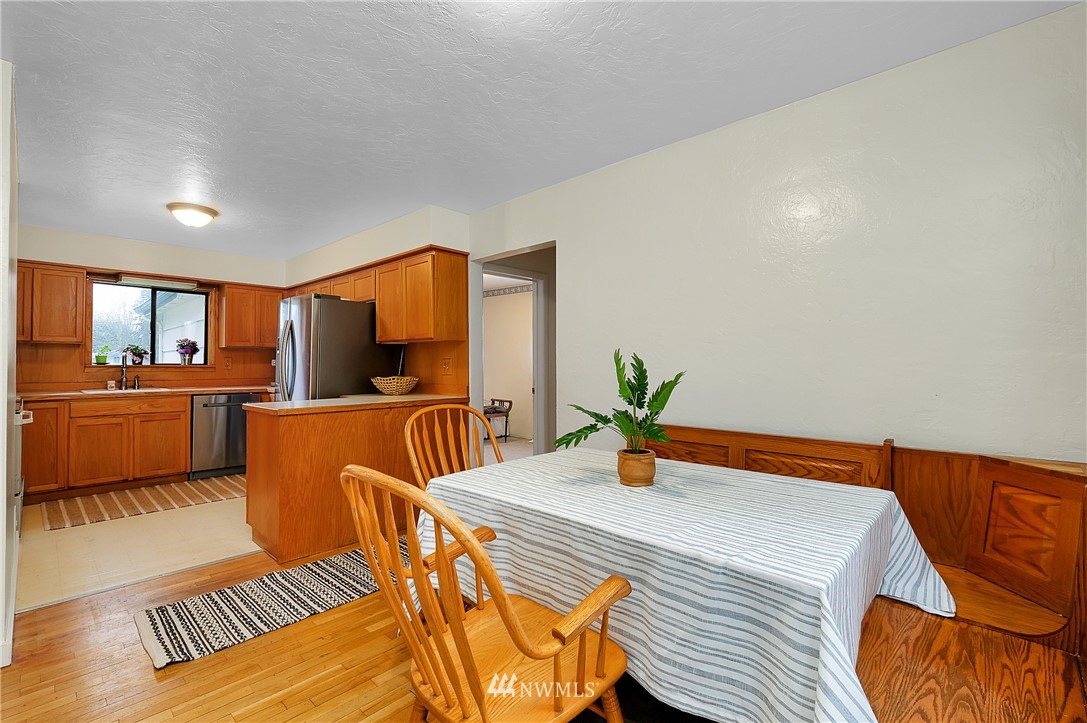 3530 Pine Road Bremerton, WA 98310 - Photo 14 of 34 a bedroom with a bed and wooden floor