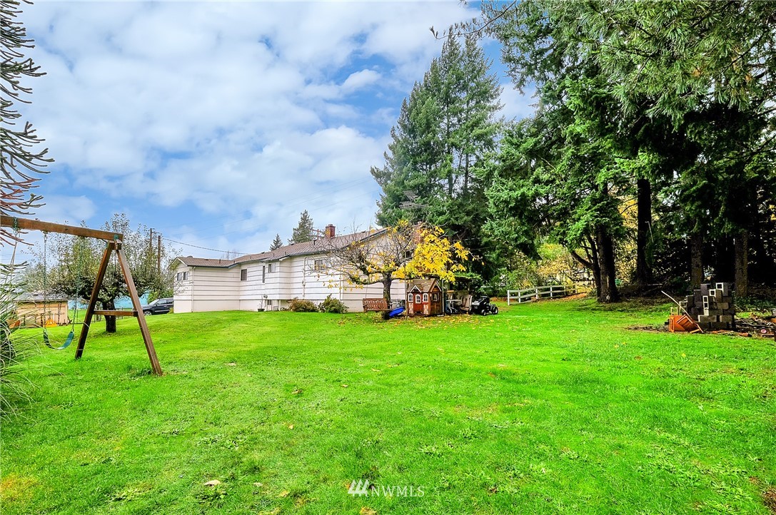 3530 Pine Road Bremerton, WA 98310 - Photo 27 of 34 a view of a house with a backyard