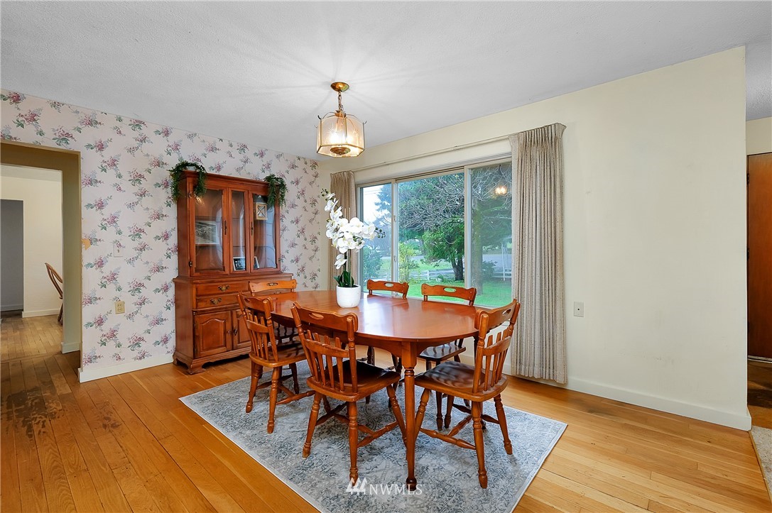 3530 Pine Road Bremerton, WA 98310 - Photo 10 of 34 a view of a dining room with furniture window and wooden floor