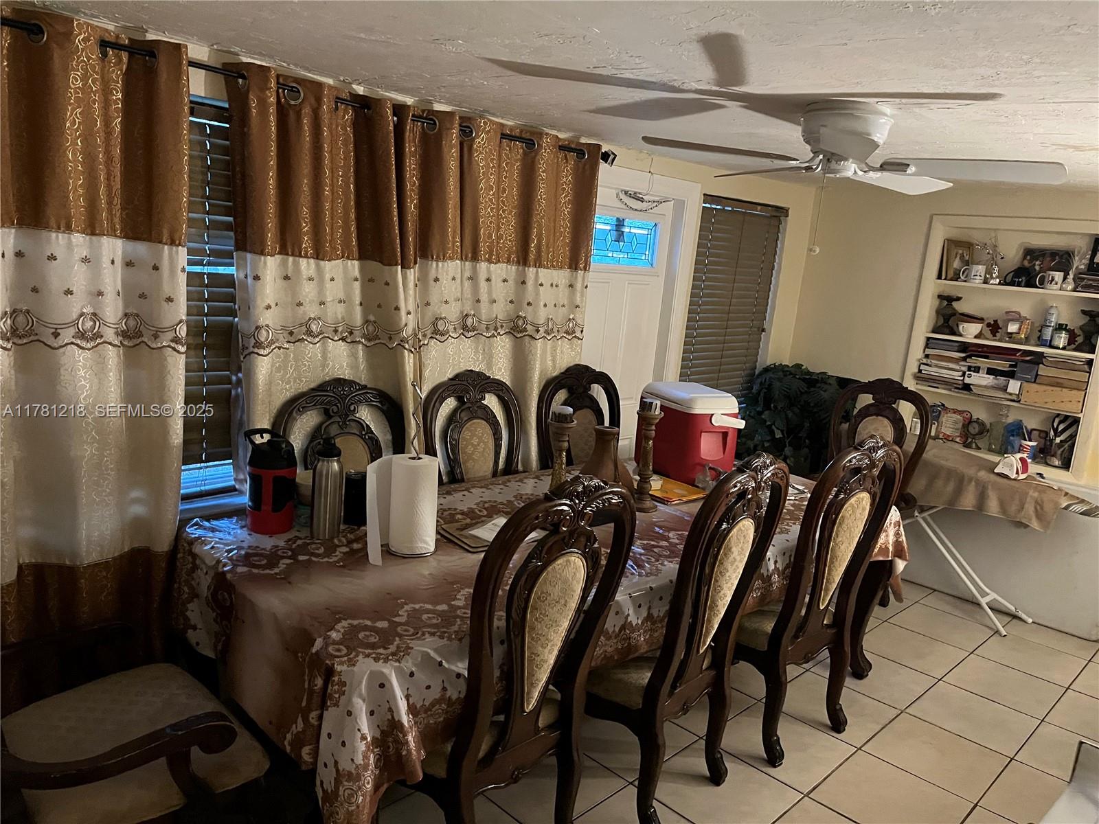 6546 Southwest 20th Court Miramar, FL 33023 - Photo 14 of 19 a kitchen with stainless steel appliances granite countertop a stove a sink and a refrigerator