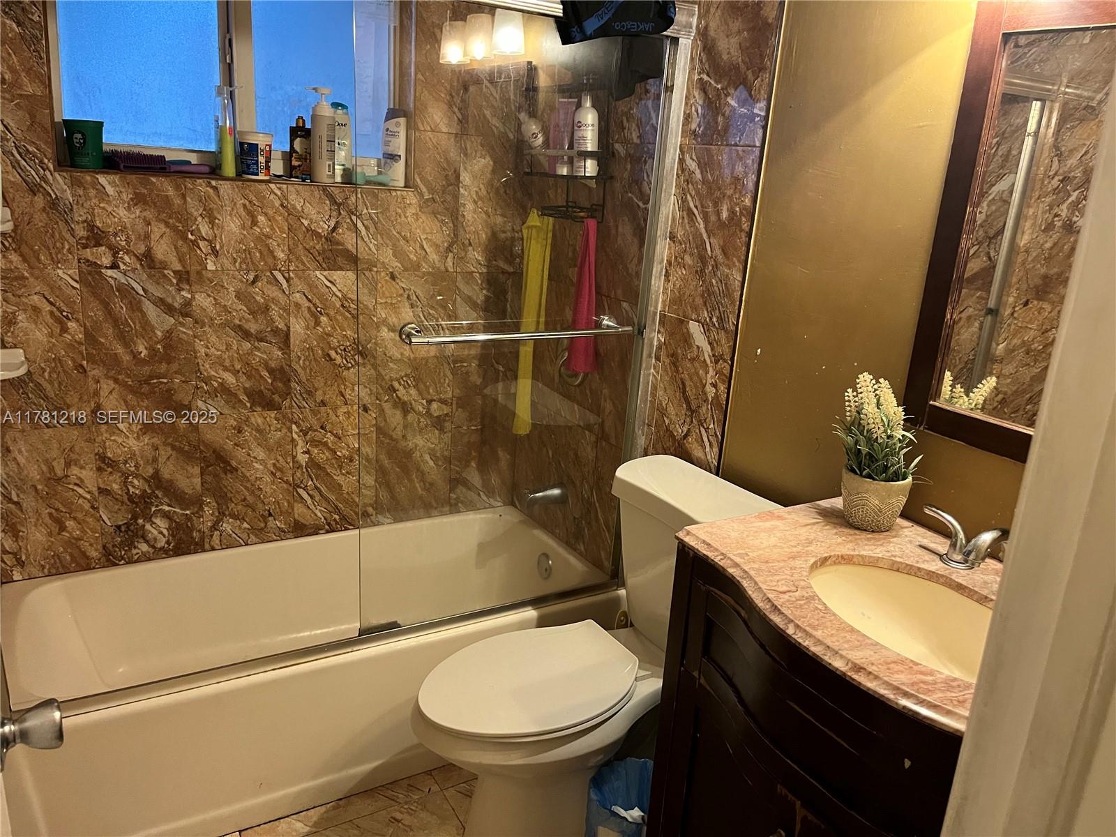 6546 Southwest 20th Court Miramar, FL 33023 - Photo 15 of 19 a bathroom with a sink and toilet