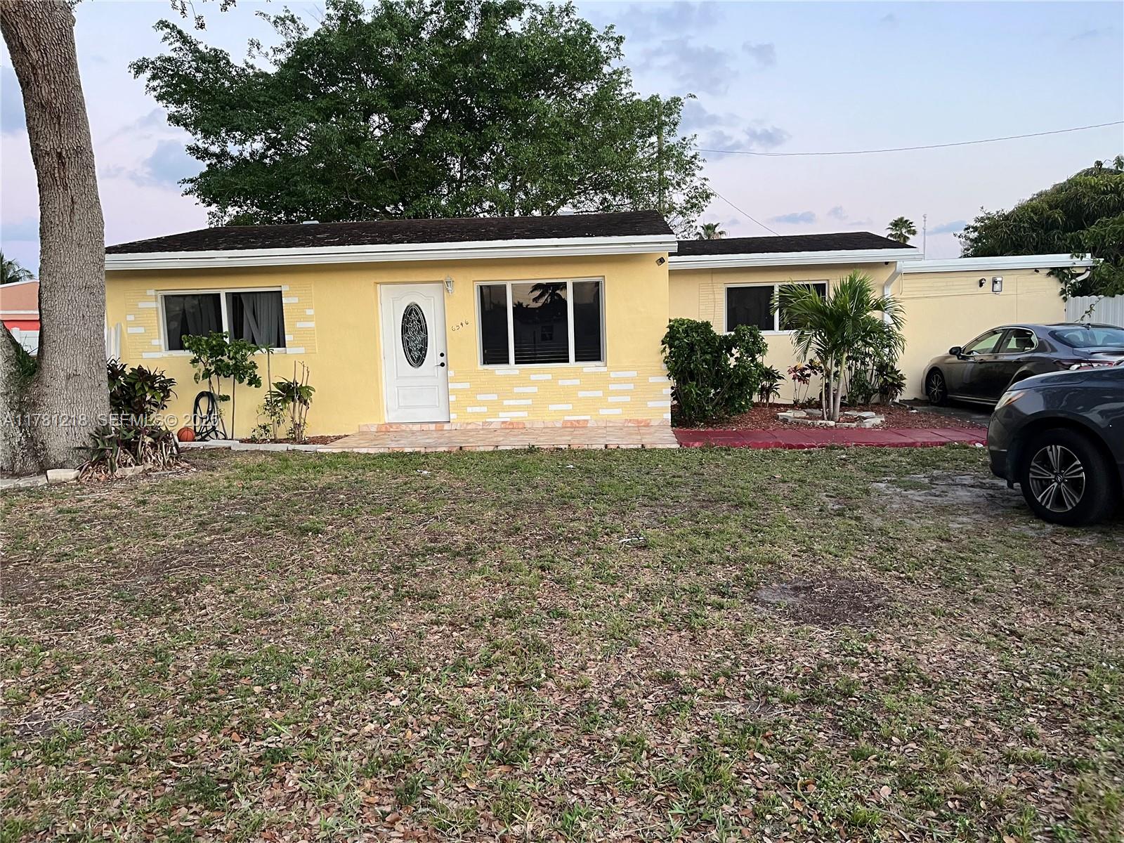 6546 Southwest 20th Court Miramar, FL 33023 - Photo 18 of 19 a view of a house with a patio