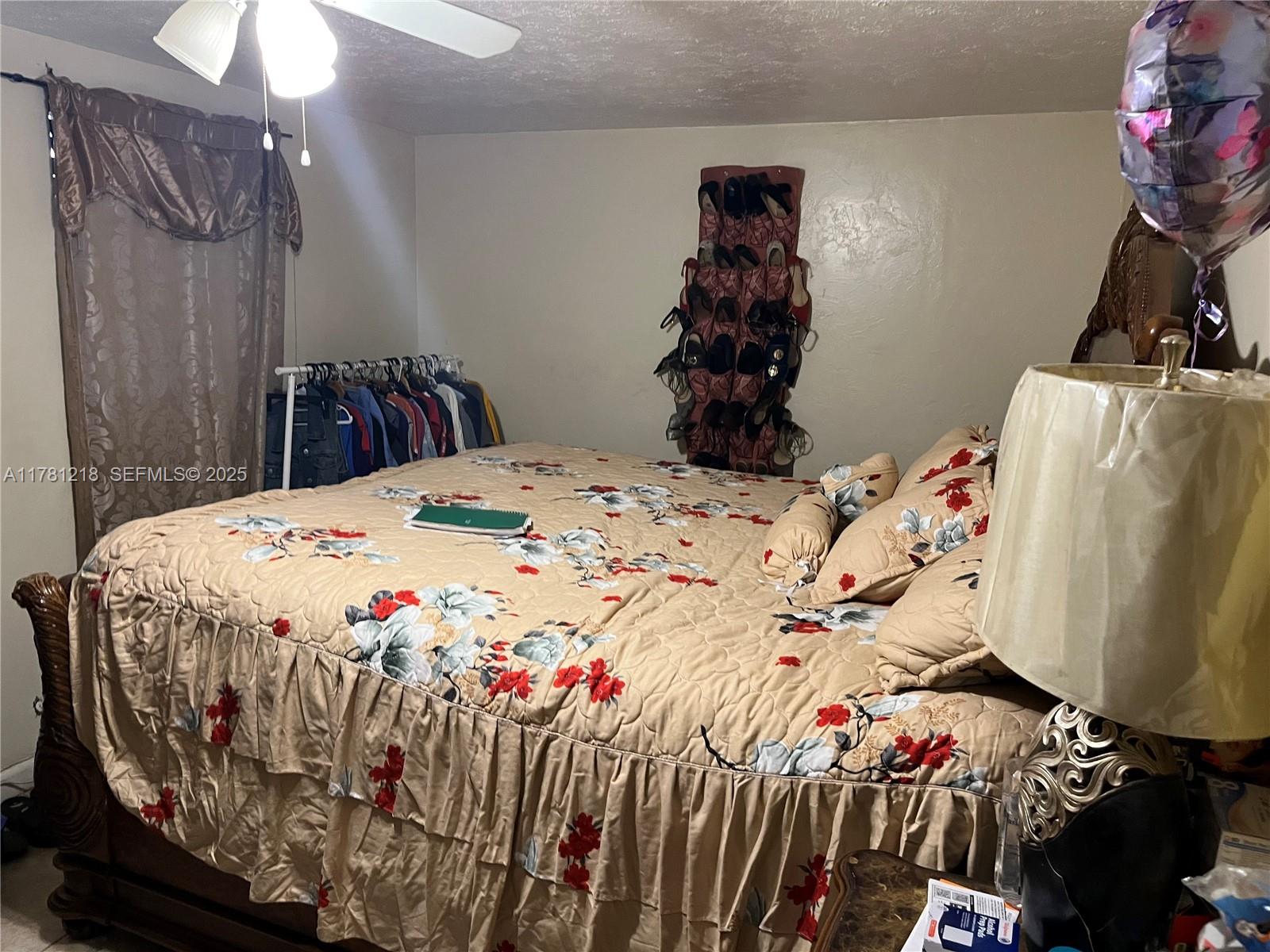 6546 Southwest 20th Court Miramar, FL 33023 - Photo 8 of 19 a bed sitting in a bedroom next to a window