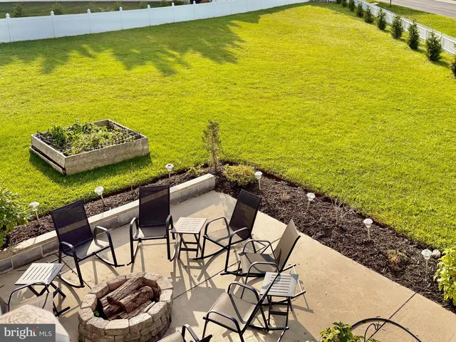 a view of an ocean with a table and chairs