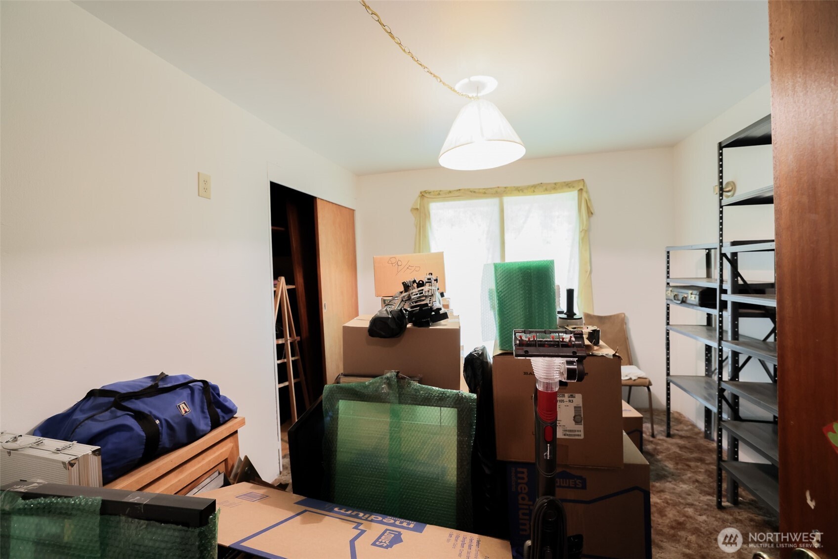 16110 178th Avenue Southeast Monroe, WA 98272 - Photo 19 of 35 a living room with furniture a window and bookshelf