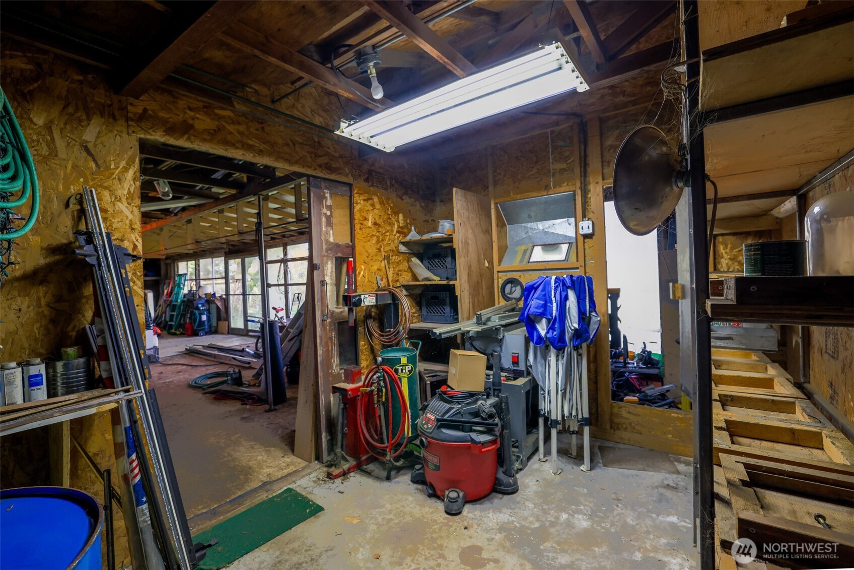 16110 178th Avenue Southeast Monroe, WA 98272 - Photo 23 of 35 a view of a storage room with shoes and stairs