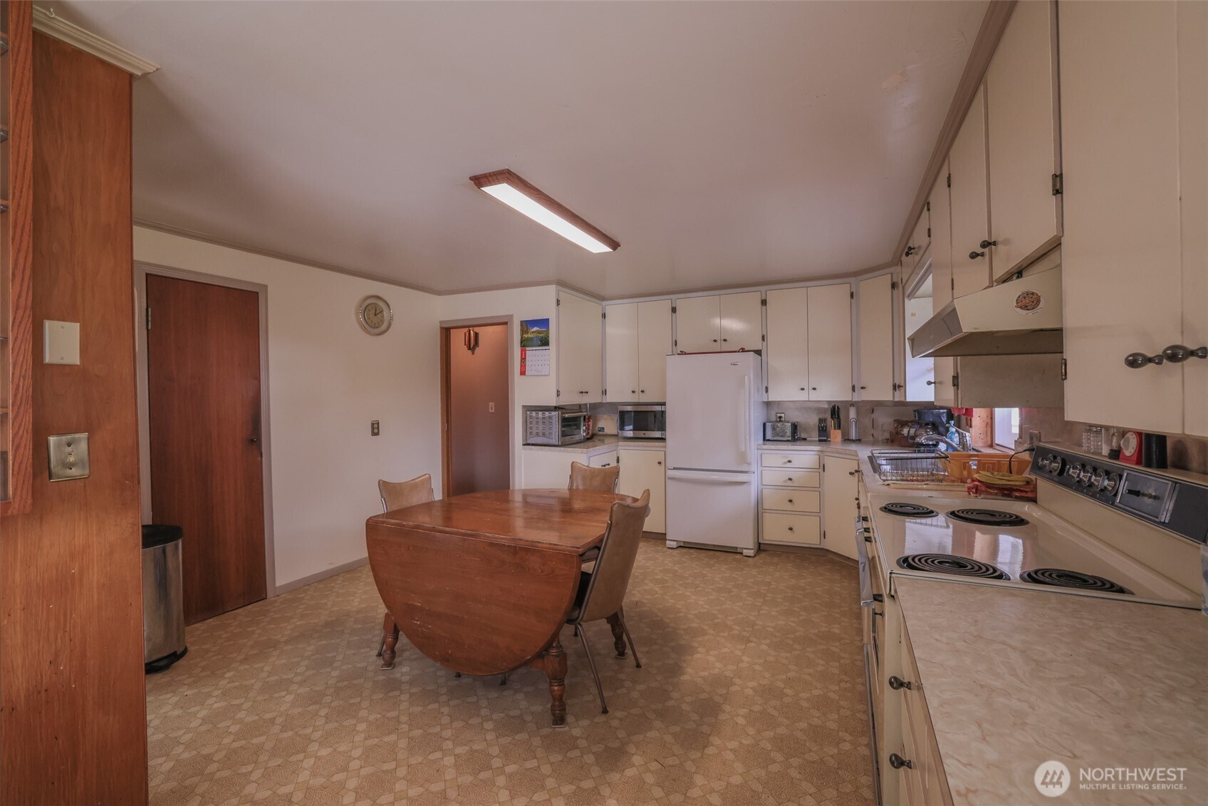 16110 178th Avenue Southeast Monroe, WA 98272 - Photo 6 of 35 a living room with furniture and a dining table with kitchen appliances