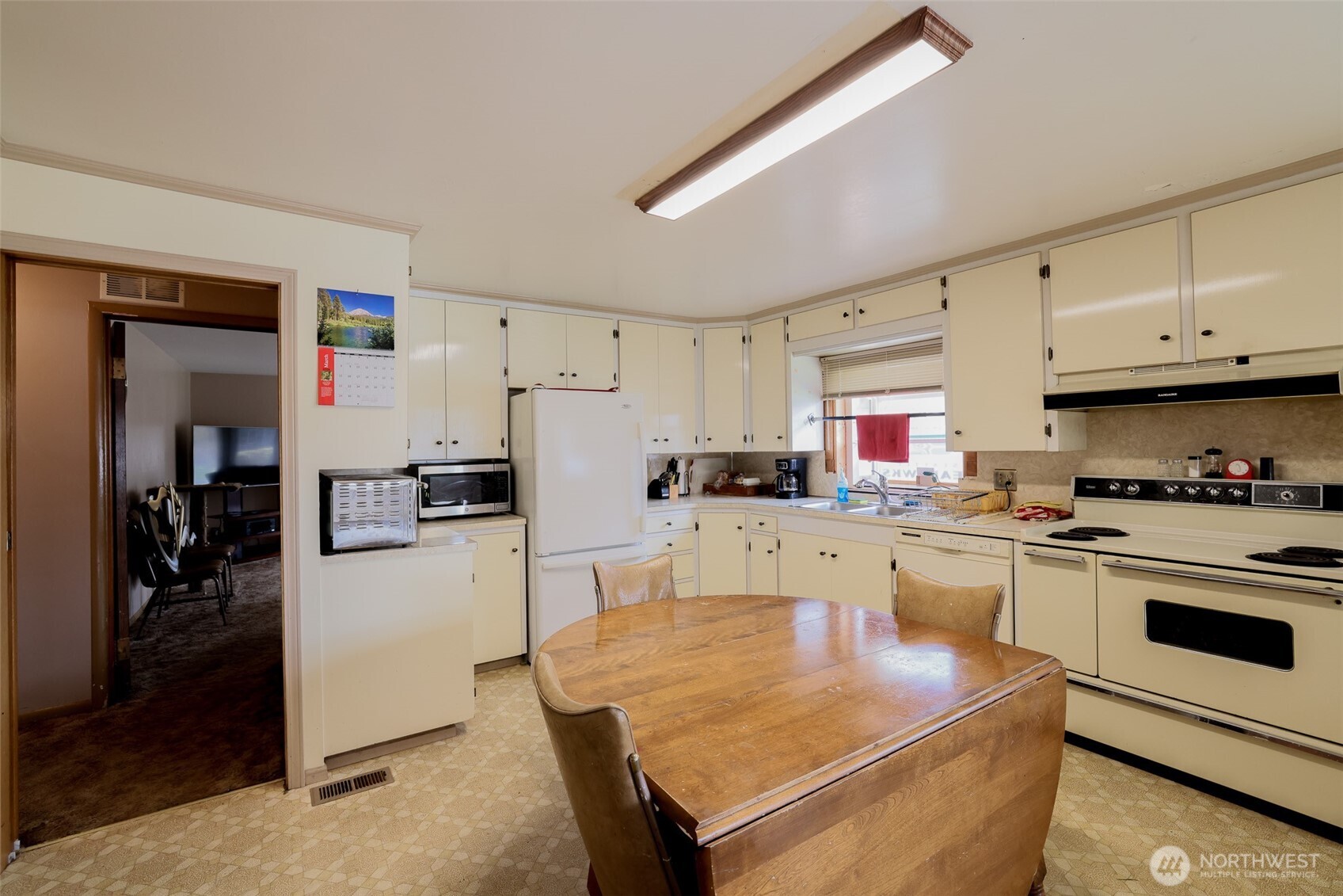 16110 178th Avenue Southeast Monroe, WA 98272 - Photo 7 of 35 a kitchen with cabinets a sink and white appliances