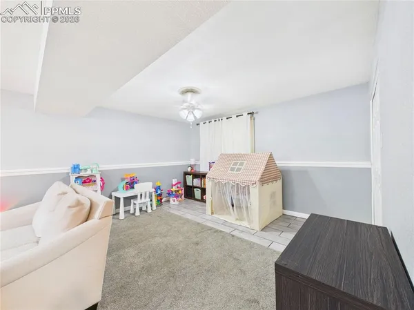 a bed room with a bed and a couch