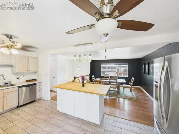 a kitchen with a sink appliances and cabinets