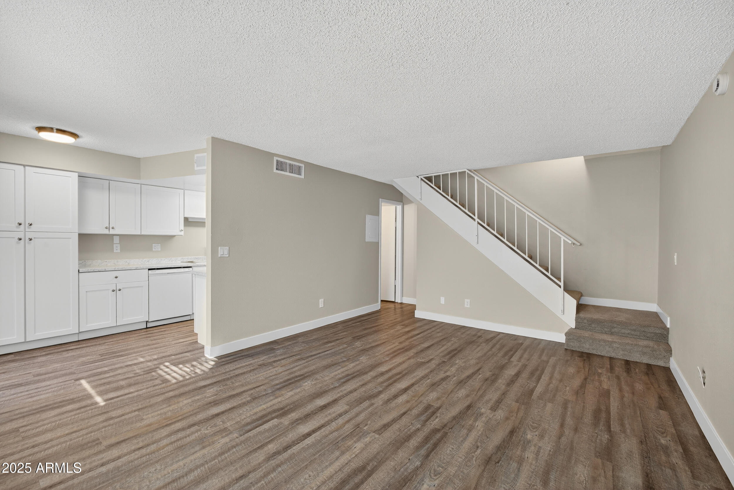 860 East Brown Road, Unit 66 Mesa, AZ 85203 - Photo 11 of 30 a view of empty room with wooden floor