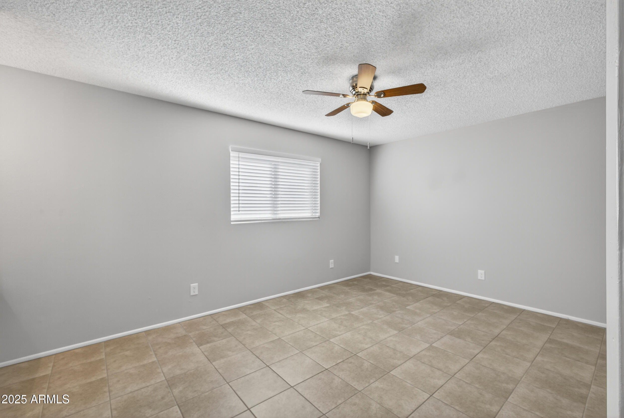 860 East Brown Road, Unit 66 Mesa, AZ 85203 - Photo 20 of 30 a view of a ceiling fan in a room