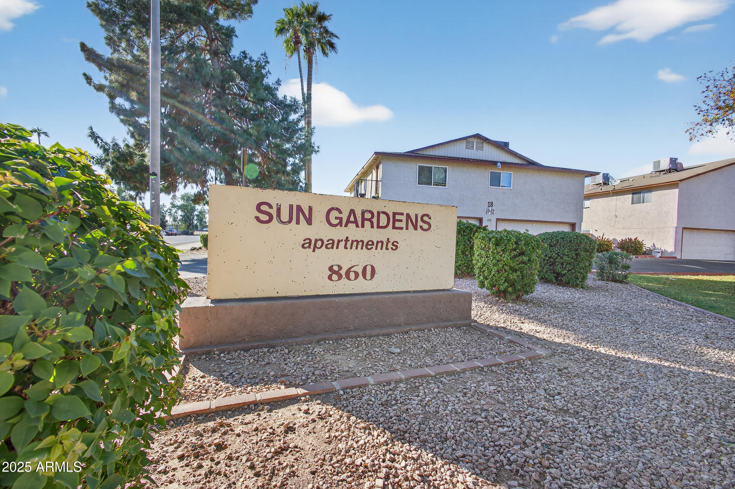 860 East Brown Road, Unit 66 Mesa, AZ 85203 - Photo 2 of 30 a sign on the side of a building