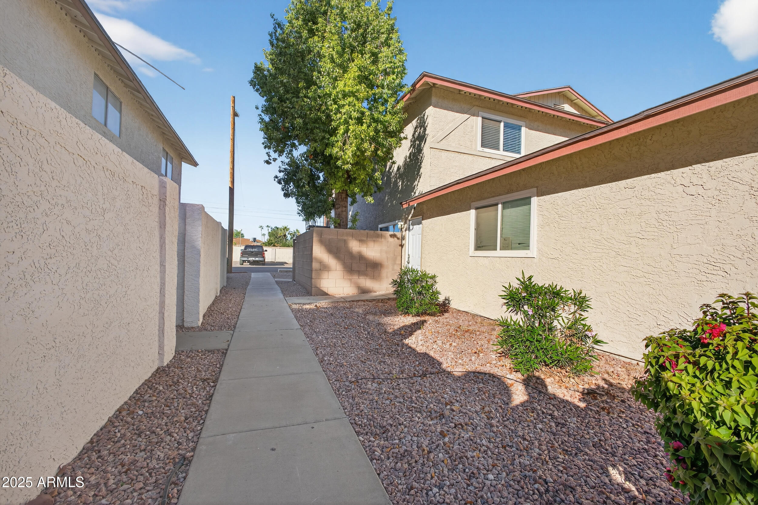 860 East Brown Road, Unit 66 Mesa, AZ 85203 - Photo 25 of 30 a view of a house with a yard