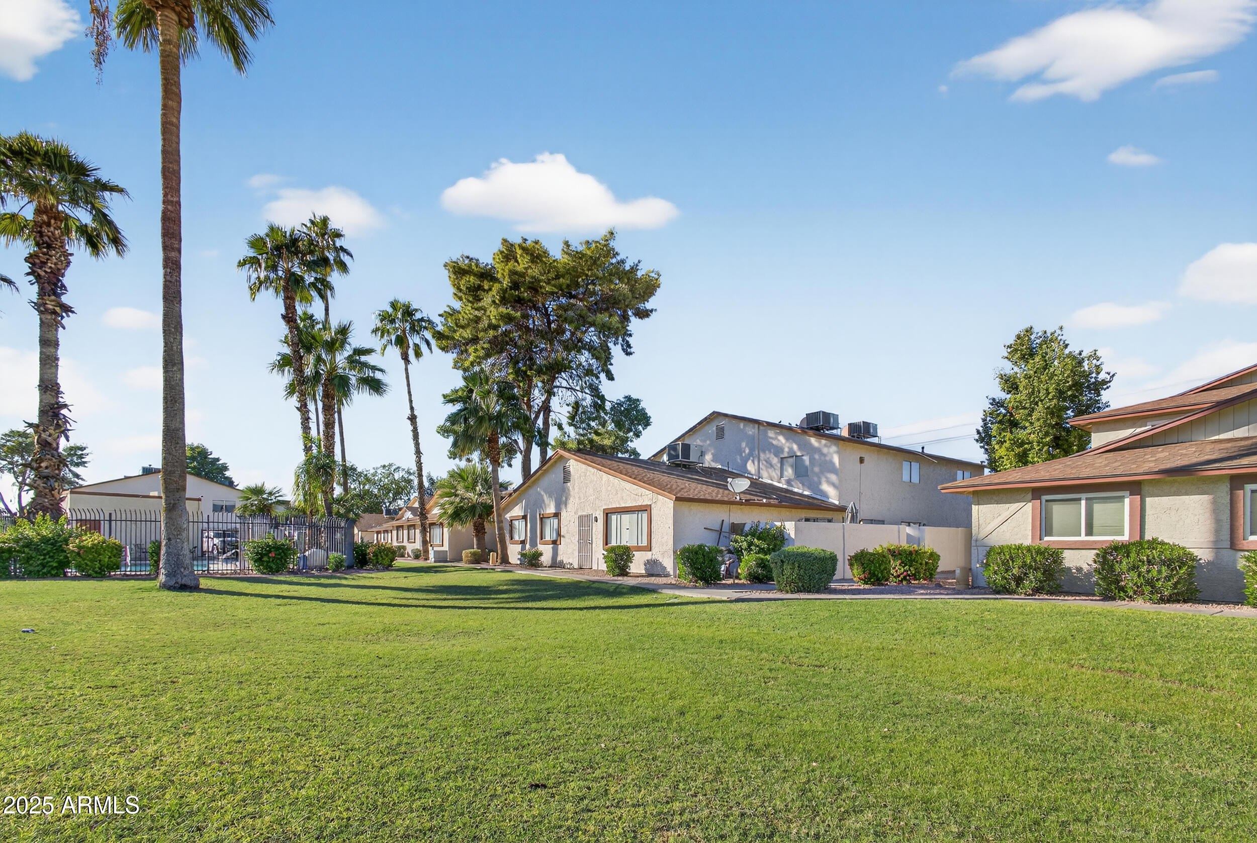 860 East Brown Road, Unit 66 Mesa, AZ 85203 - Photo 28 of 30 a front view of house with yard and trees