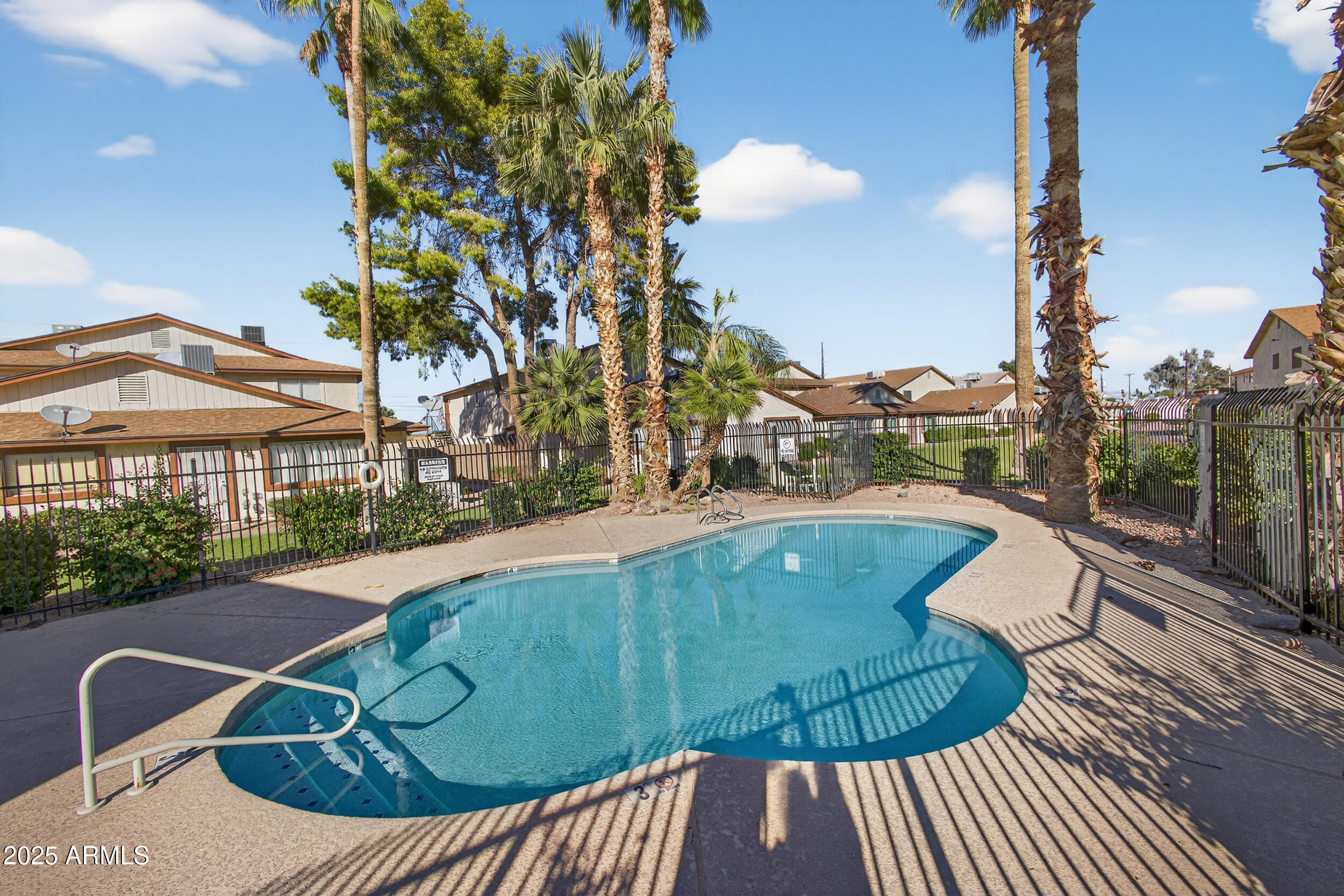 860 East Brown Road, Unit 66 Mesa, AZ 85203 - Photo 30 of 30 a view of a swimming pool with a patio