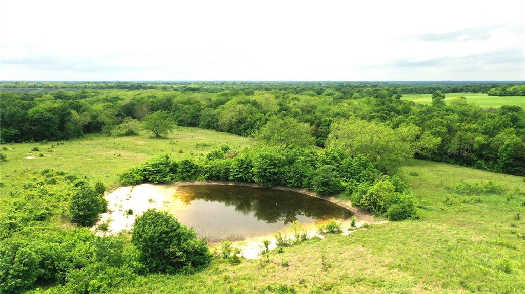 1601 County Road 3106 Bonham, TX 75418 - Photo 25 of 34 Birds eye view of property featuring a water view