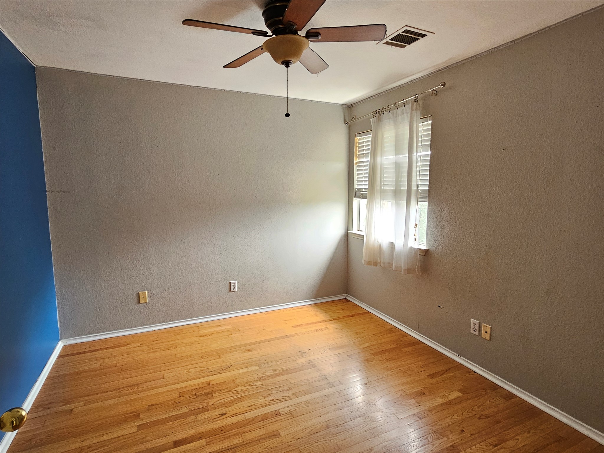 4672 Mather Kyle, TX 78640 - Photo 17 of 28 a view of empty room with wooden floor and fan