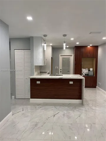 a bathroom with a sink vanity and a mirror
