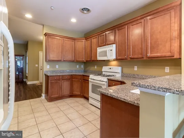 a view of a living room and dining room