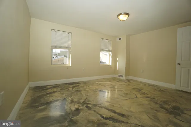 a view of an empty room and window