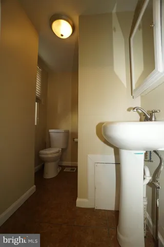 a bathroom with a sink and toilet