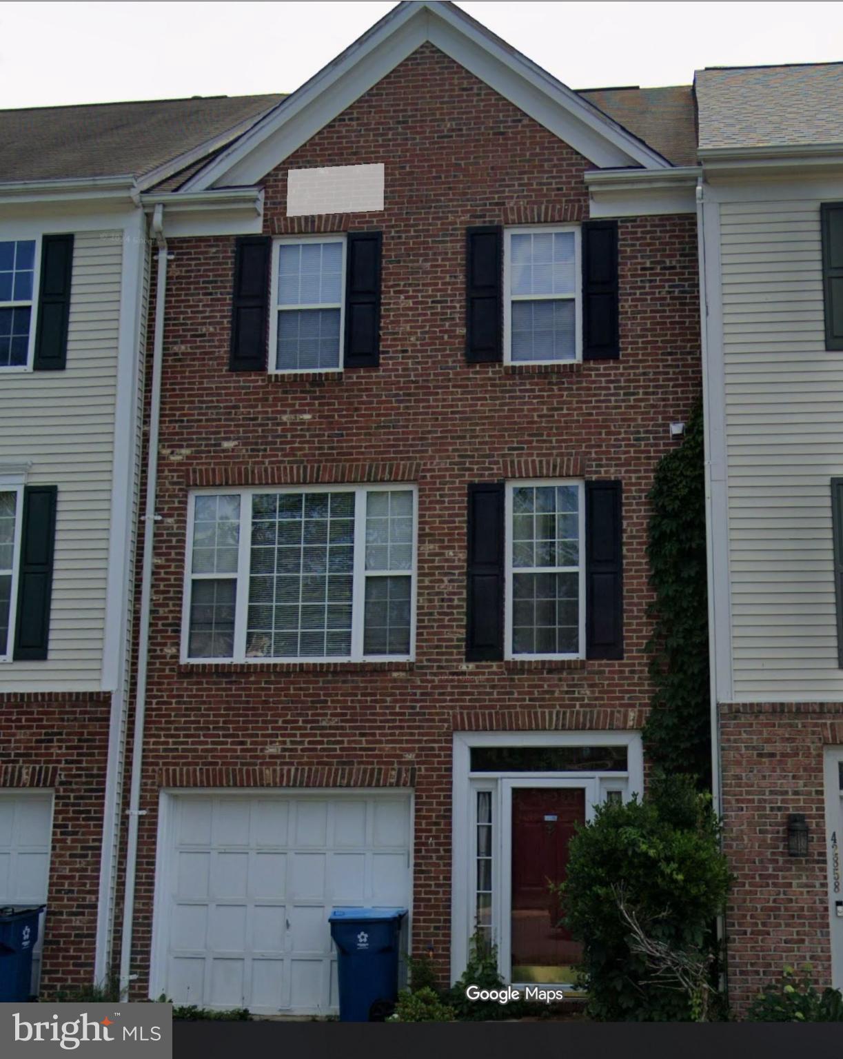 a front view of a house with yard