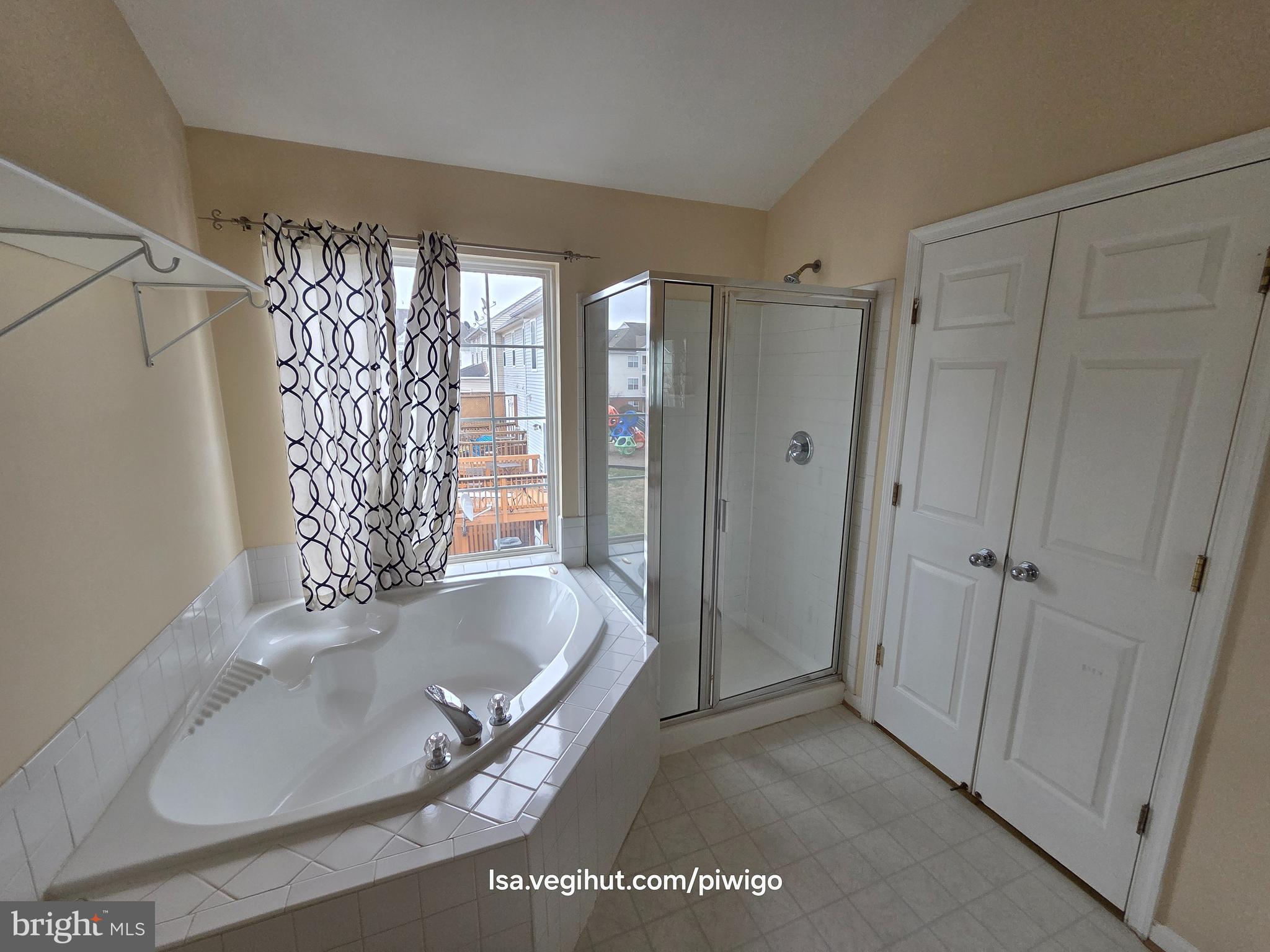 42856 Golf View Drive Chantilly, VA 20152 - Photo 14 of 23 a bathroom with a tub a sink and shower