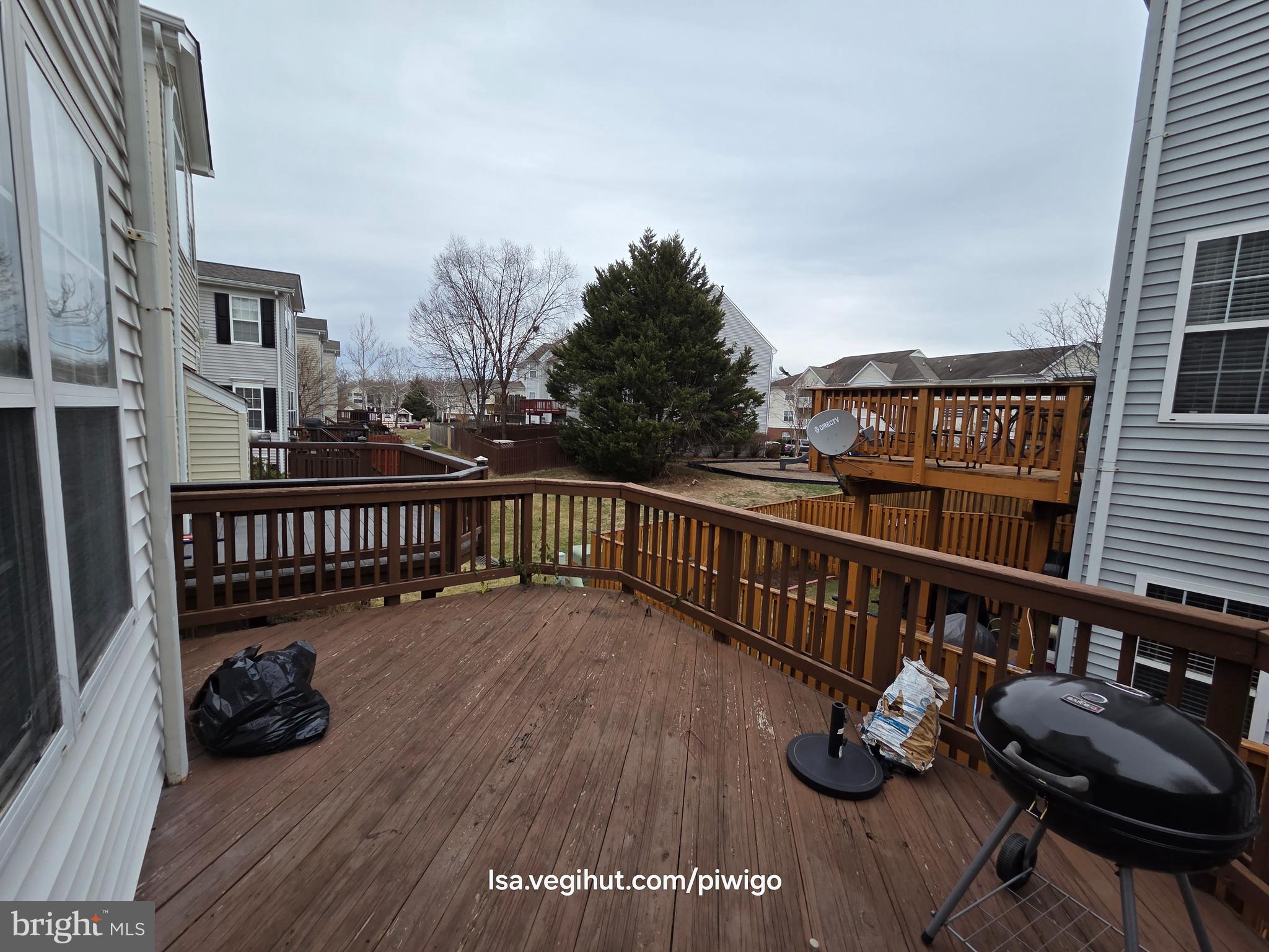 42856 Golf View Drive Chantilly, VA 20152 - Photo 19 of 23 a view of a balcony with chairs and wooden floor