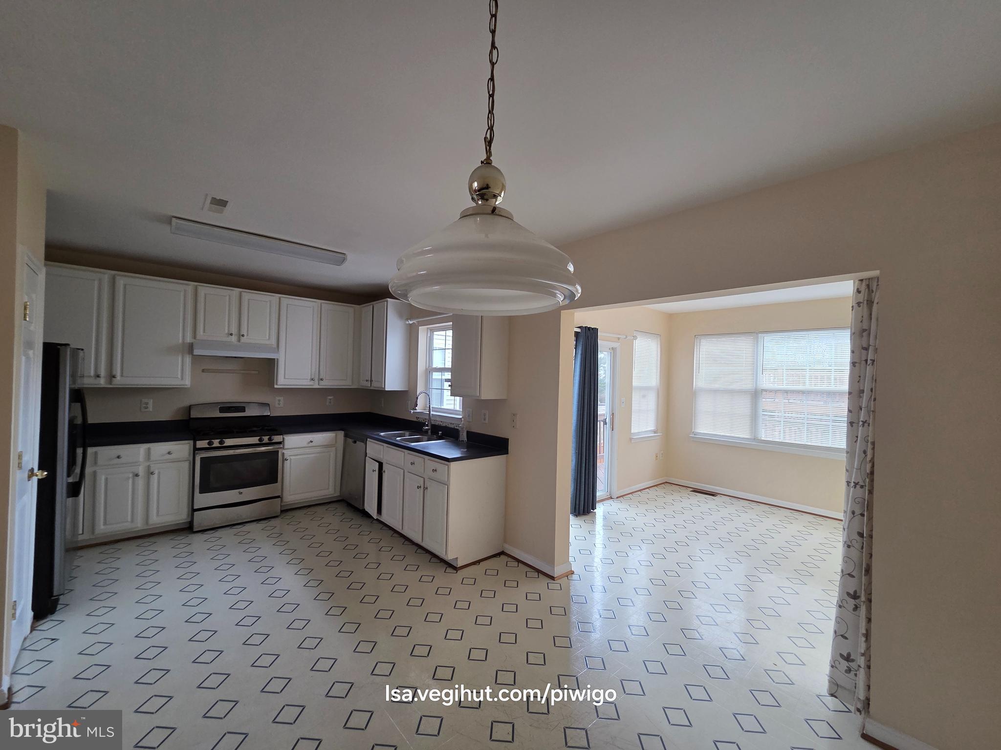 42856 Golf View Drive Chantilly, VA 20152 - Photo 2 of 23 a large kitchen with a stove a sink dishwasher and a refrigerator