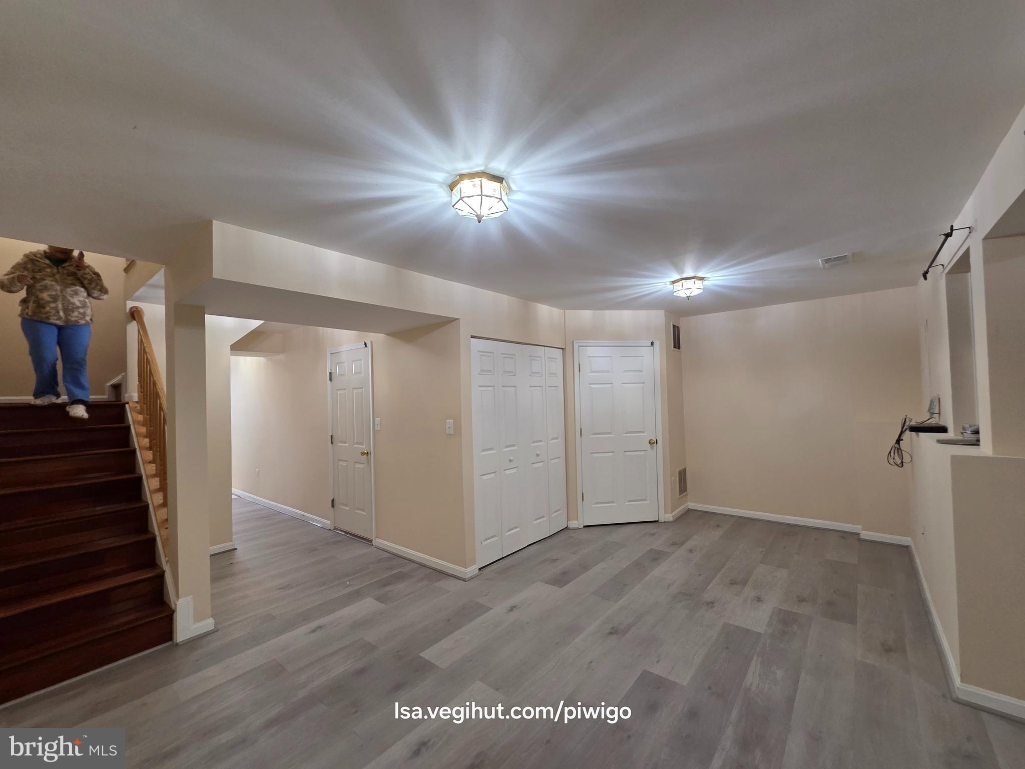 42856 Golf View Drive Chantilly, VA 20152 - Photo 9 of 23 a view of a hallway with a chandelier fan