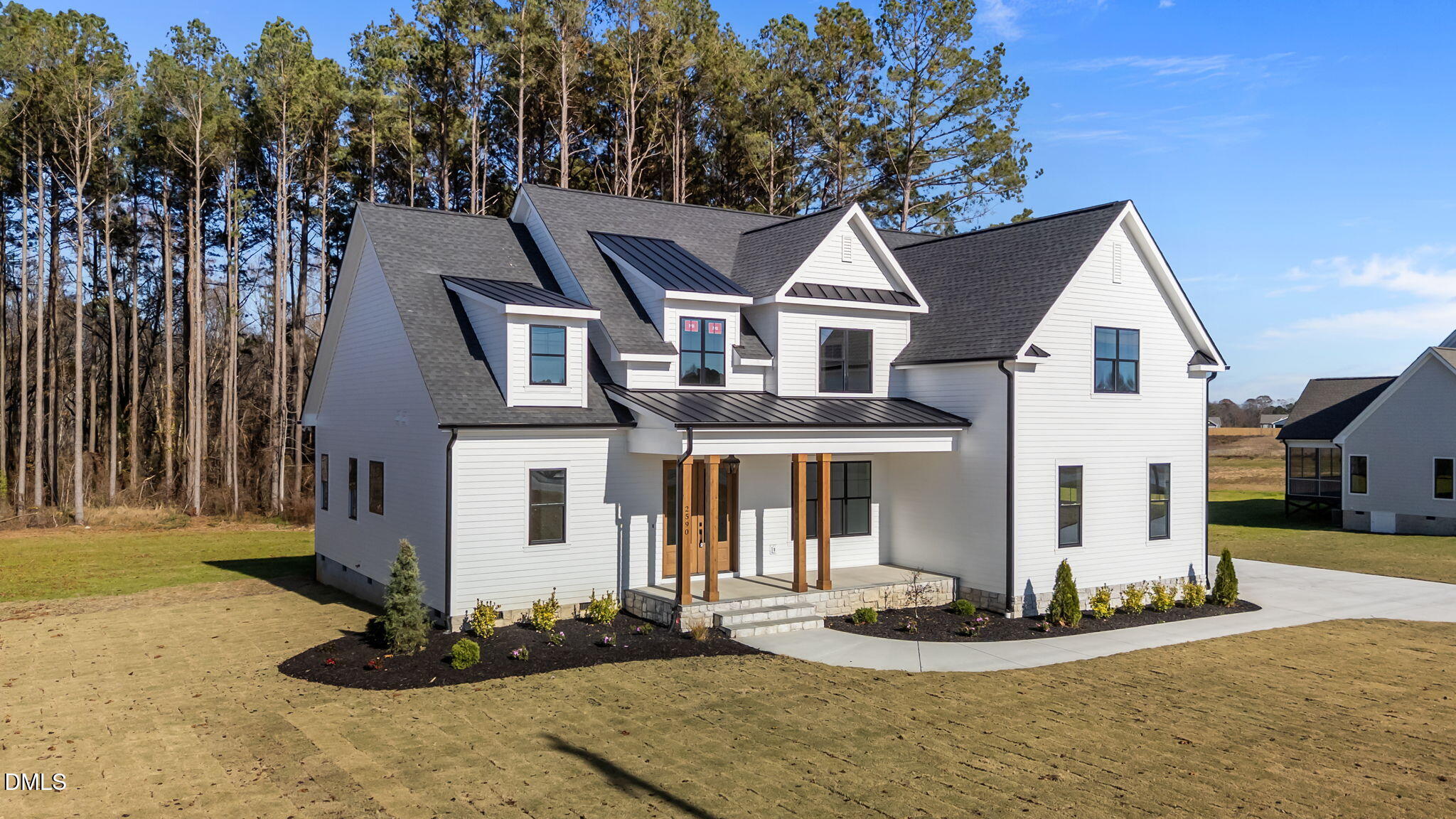 2590 Lassiter Road Four Oaks, NC 27524 - Photo 4 of 72 a front view of a house with a yard