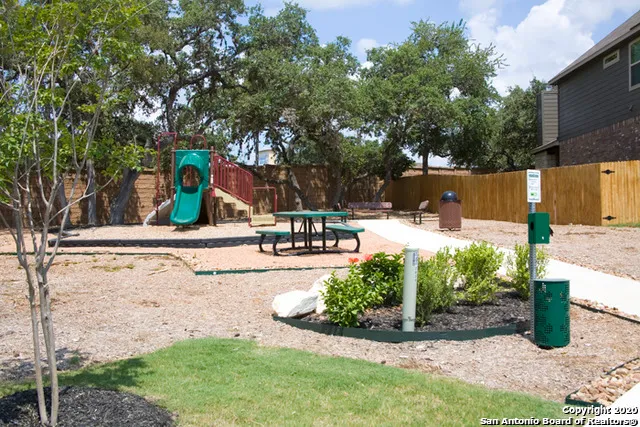 a view of a backyard with sitting area