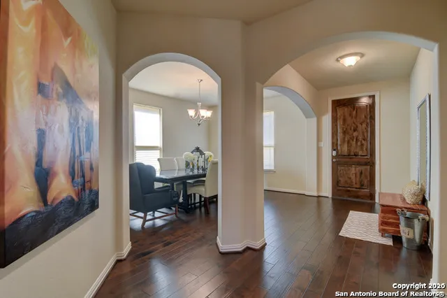 a view of a livingroom with furniture and hardwood floor