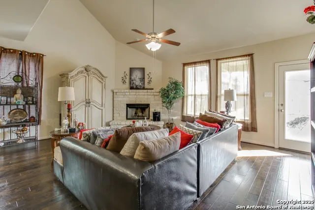a living room with furniture and a fireplace
