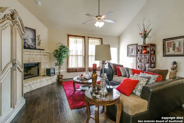a living room with furniture fireplace and a flat screen tv