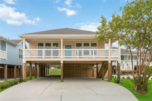 a front view of residential houses with yard