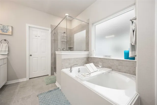 a bathroom with a bathtub and a sink