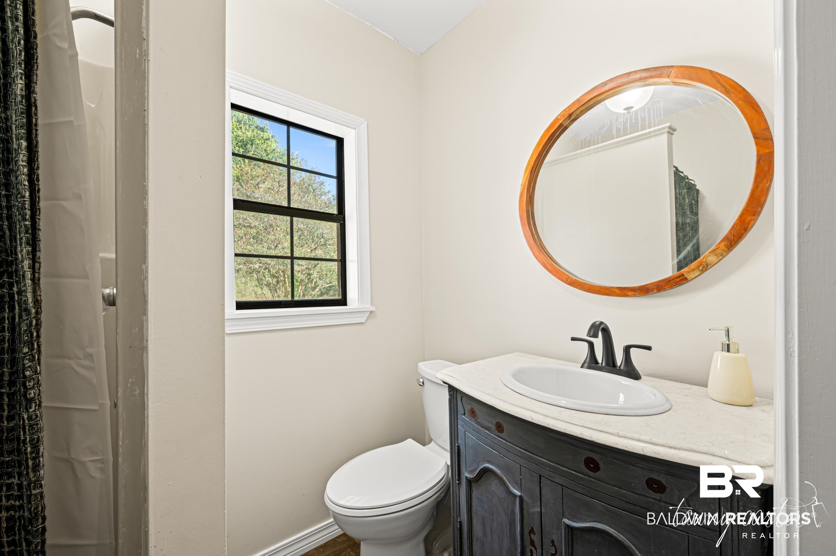 3086 Wild Fork Road Frisco City, AL 36445 - Photo 13 of 30 Bathroom with a shower with curtain and vanity