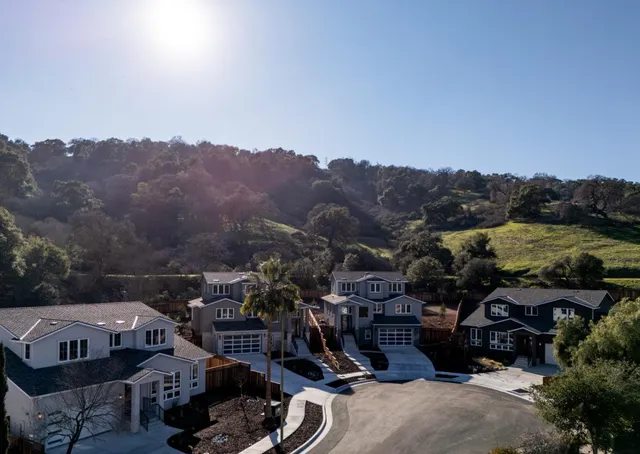 an aerial view of a house with a ocean view