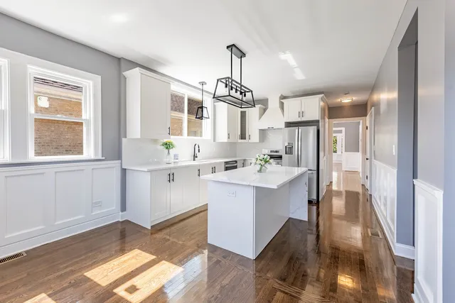 a kitchen with a sink stove and refrigerator